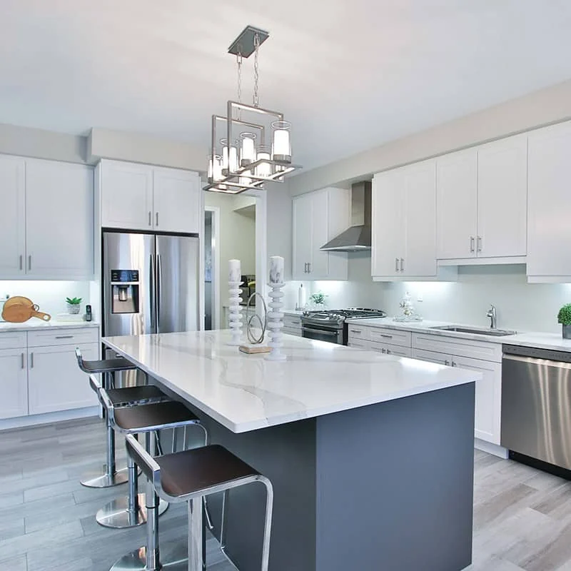 White solid surface kitchen island and perimeter worktops