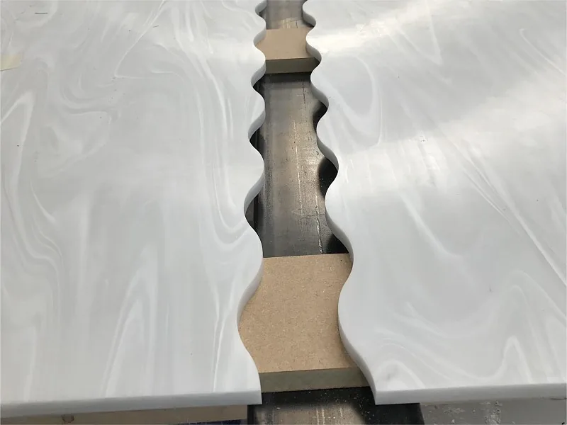 Solid surface components prepared for a matching curved joint